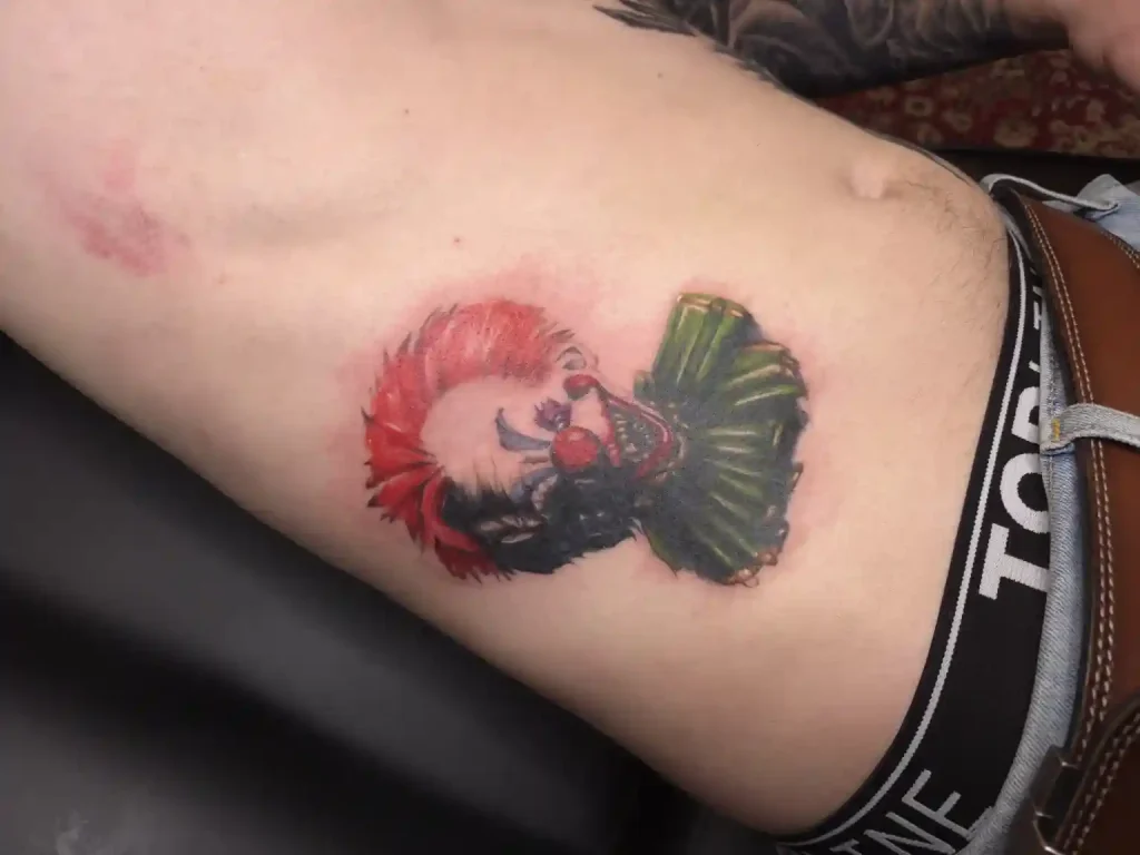 Close-up healed cover-up tattoo showing smooth line work over previous ink