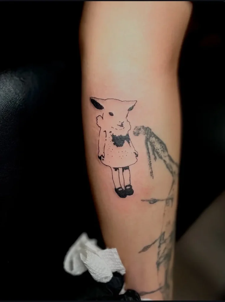 Black linework lamb girl character tattoo on inner forearm, Tainted Flesh Body Art North, Wilmington DE