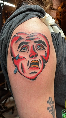 Detailed color tattoo sleeve piece with layered custom artwork on arm