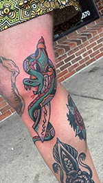 Color snake tattoo on the leg